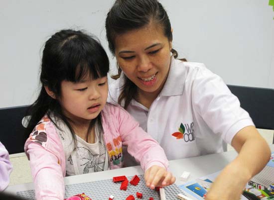 Changing lives with Legos and paper hats