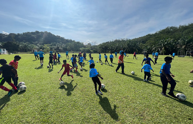 QI Staff, PJ City FC Coaches Uplift Kids in Employee Community Impact Event