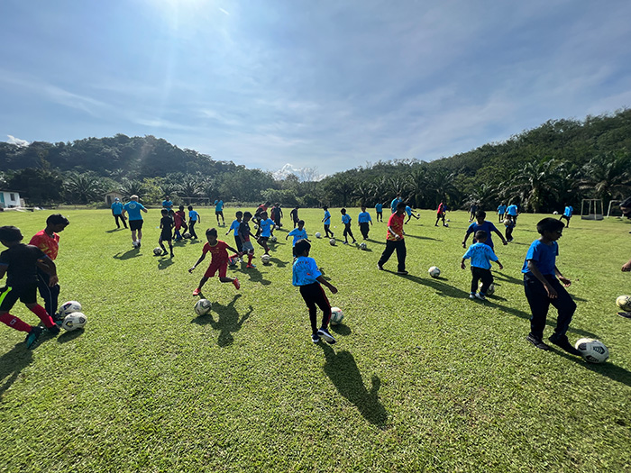 QI Staff, PJ City FC Coaches Uplift Kids in Employee Community Impact Event