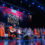 Musicians and a choir perform on stage at the Kala Vriksha event.
