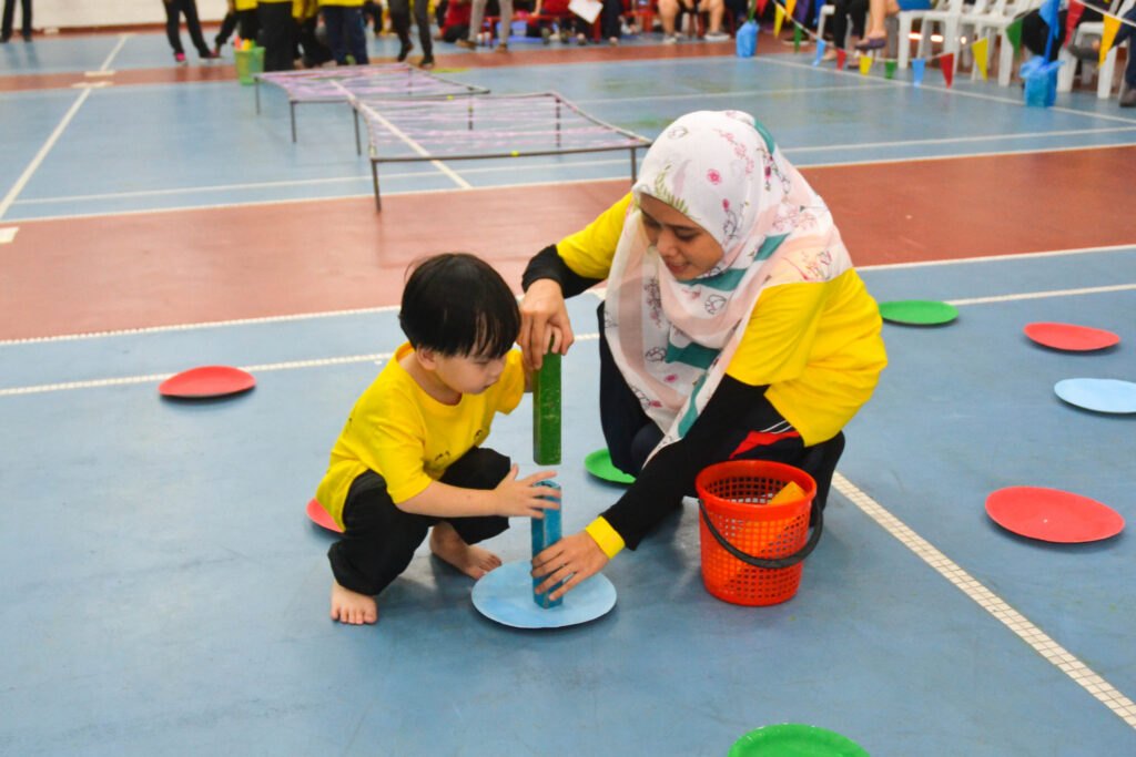 Hands-on guidance with children on the spectrum at Taarana Centre helps support not just the child's development, but also family wellness as a whole. 