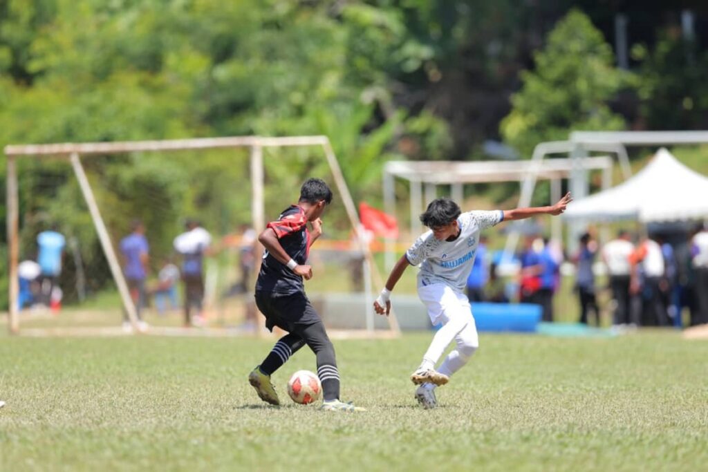 Participants in the JAGUH RF youth football programme strengthen their football skills, discipline and teamwork during a training session in Kuala Lumpur.