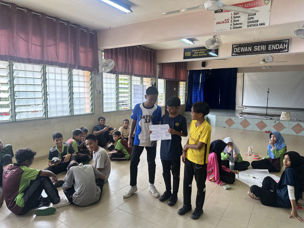 JAGUH RF youth football programme participants explore leadership, accountability and communication during a holistic personal development class.